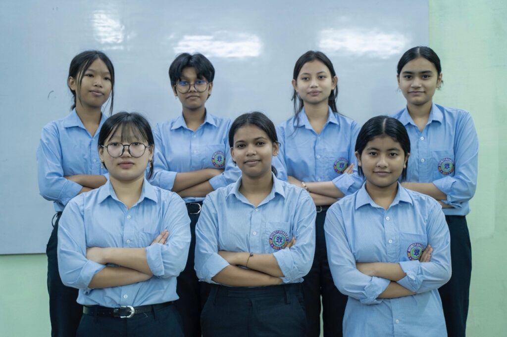 Focused students attending lecture in modern classroom of top coaching center in Guwahati