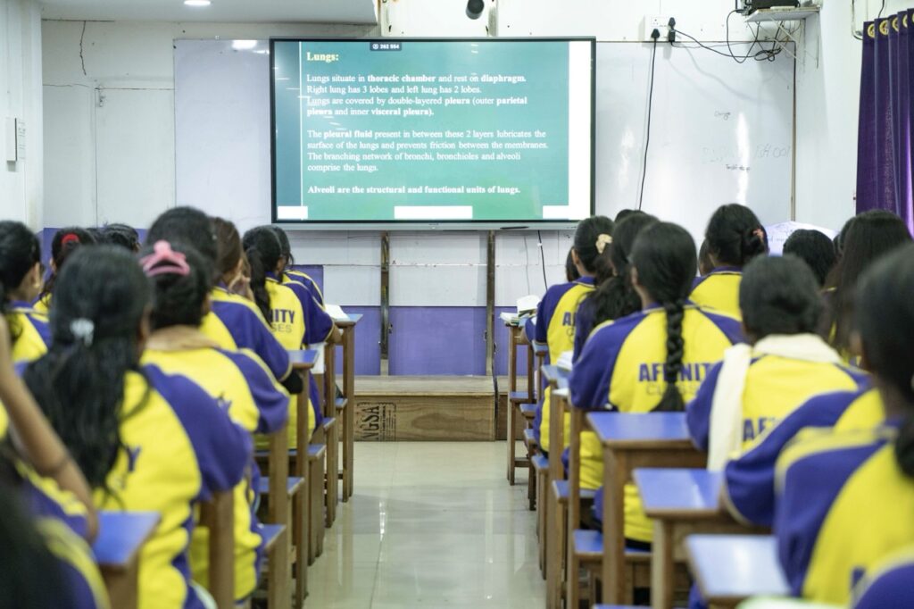 Spacious classroom with smart board and individual desks at leading coaching center in Guwahati